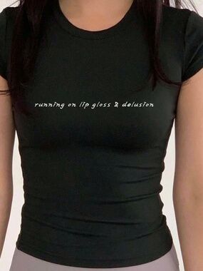 "running on lipgloss and delusion" Black Baby tee shirt